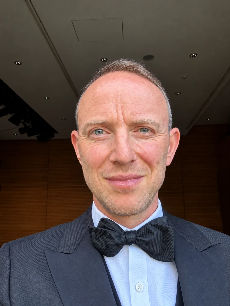Tom wearing a dinner jacket and black bow tie